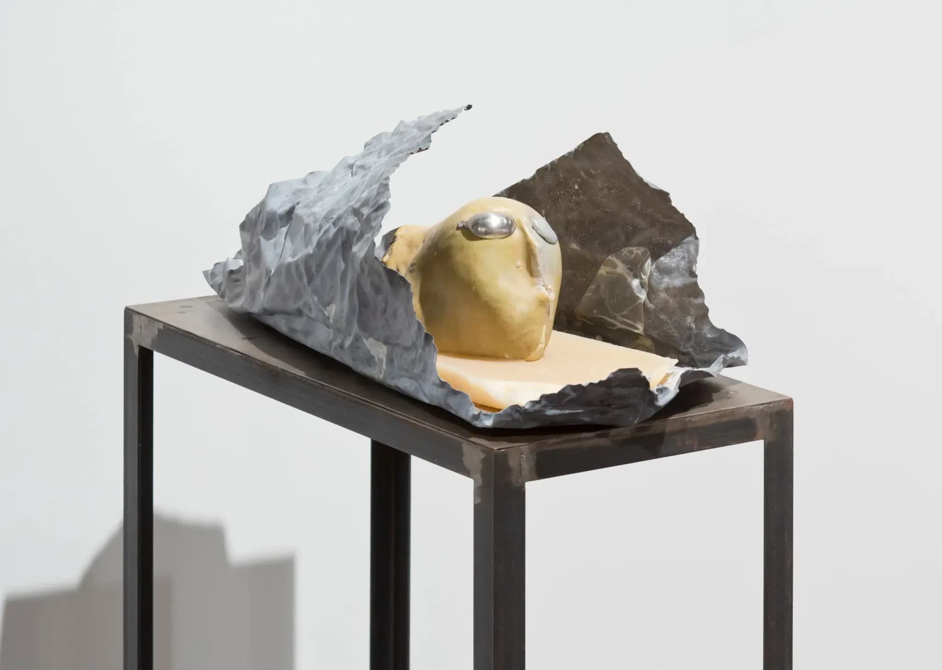 Marisa Merz, Testa, 1984–1995, clay, wax, tin, and lead on a steel table. Credit: Fondazione Merz and Gladstone Gallery, New York and Brussels.